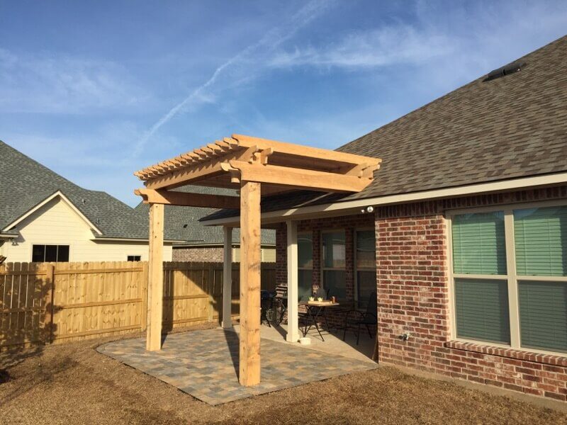 hooglands Pergolas Gazebos Arbors - 02 Custom wooden pergola enhancing outdoor space with patio area, surrounded by residential homes and wooden fencing.